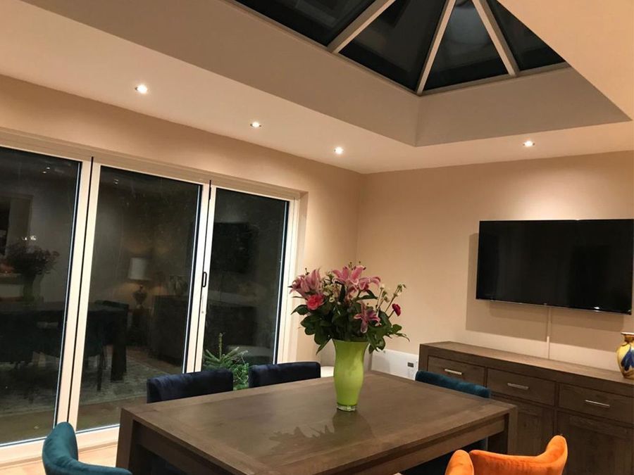 Inside the flagship EazyBase extension — roof lantern, media wall and dining area