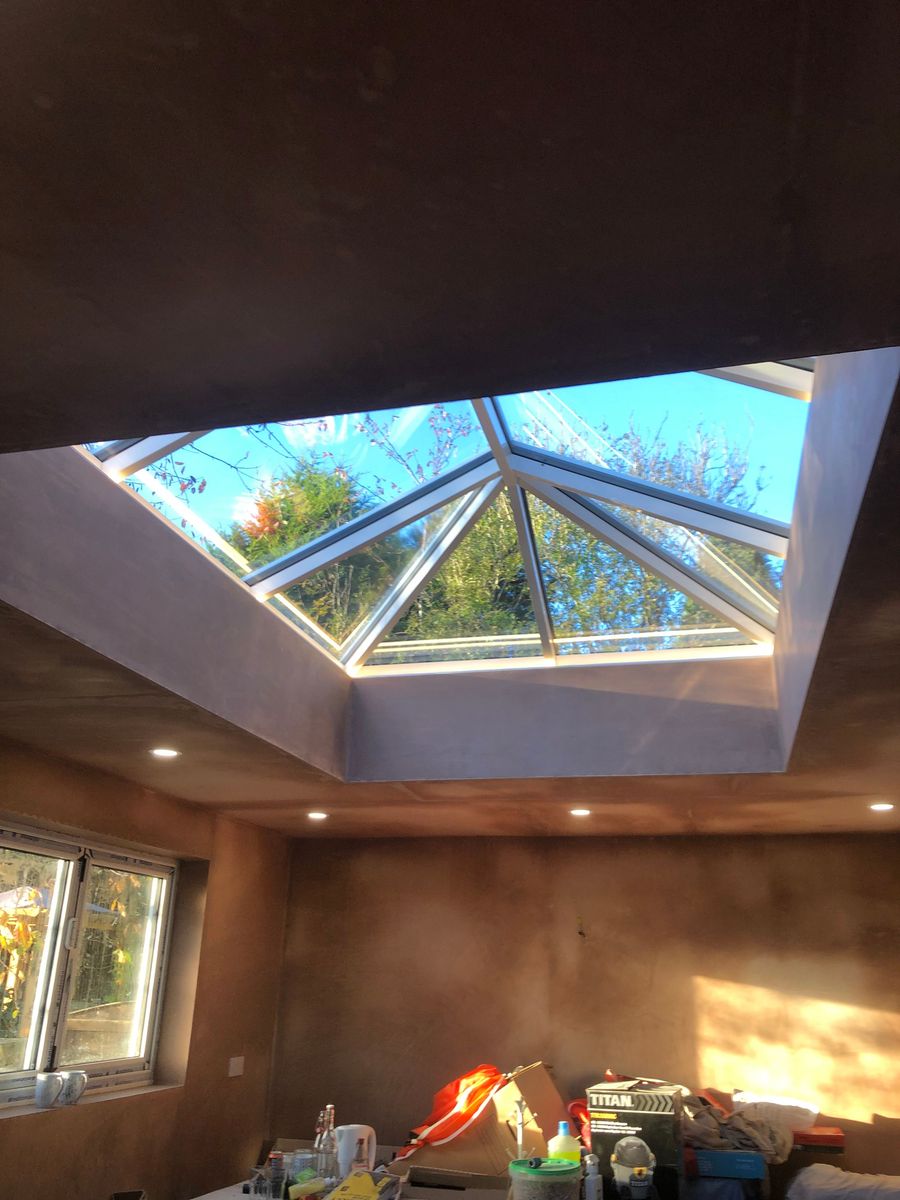 Roof lantern flooding a newly plastered extension interior with light