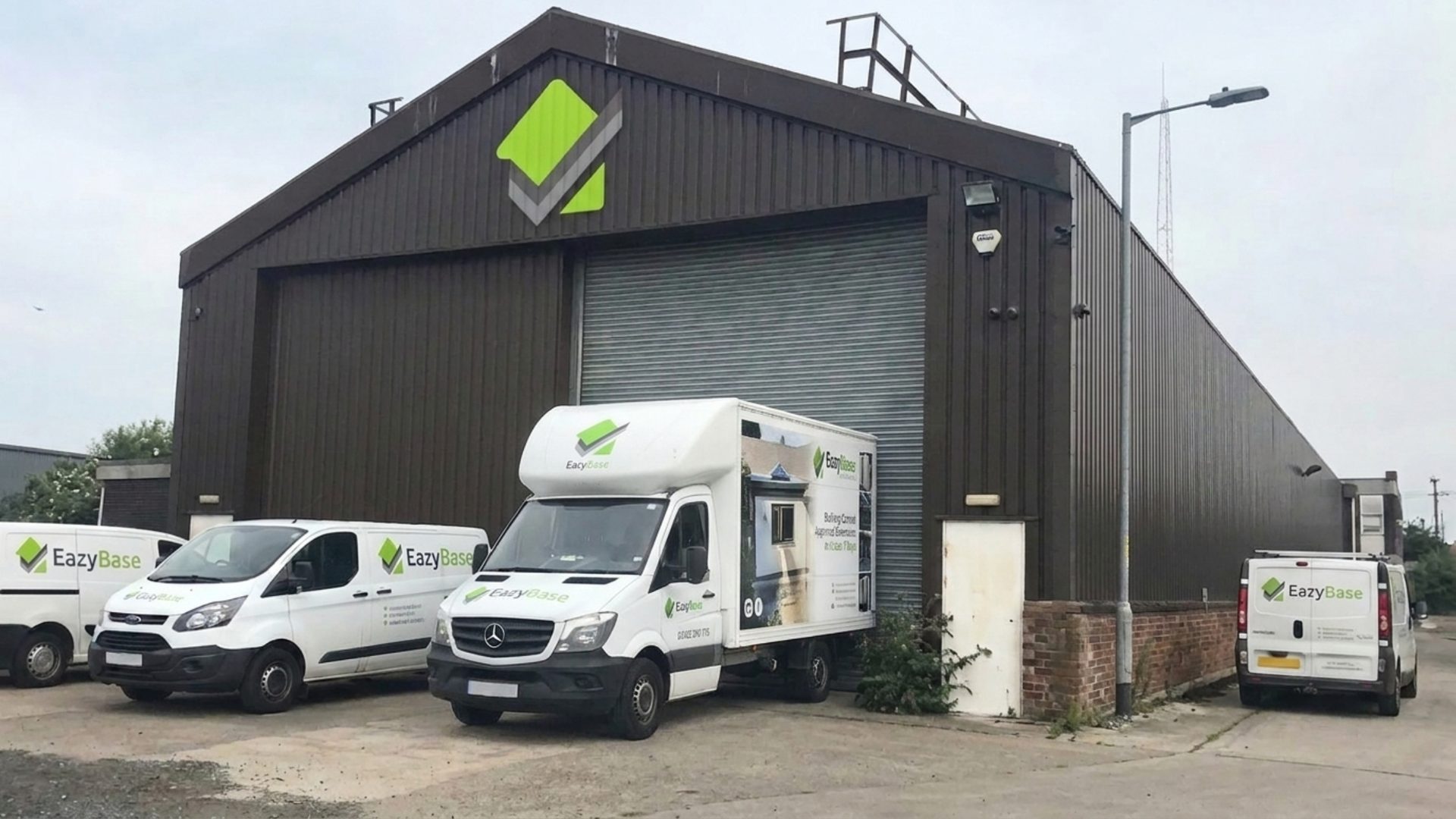 EazyBase headquarters and branded delivery fleet